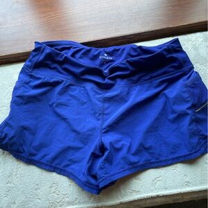 Athleta running shorts cobalt blue large. Side pockets